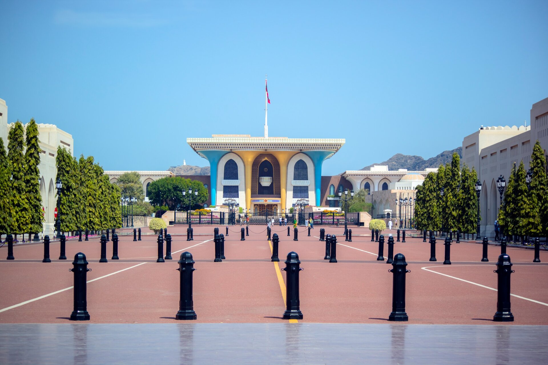 Al Alam Palace in blue and gold at the end of its grand approach, Old Muscat