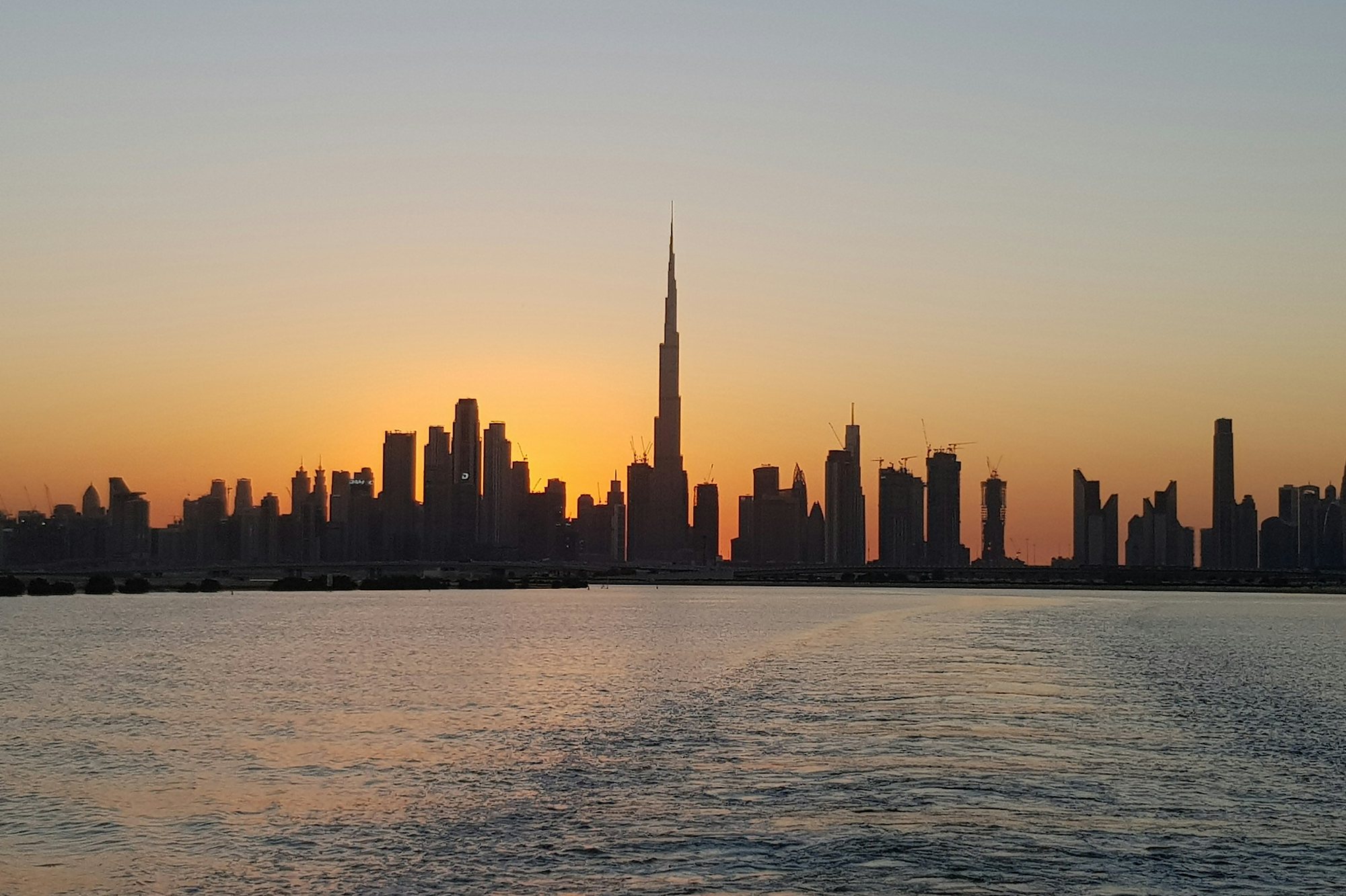 The Dubai skyline at sunset from Dubai Creek Harbour