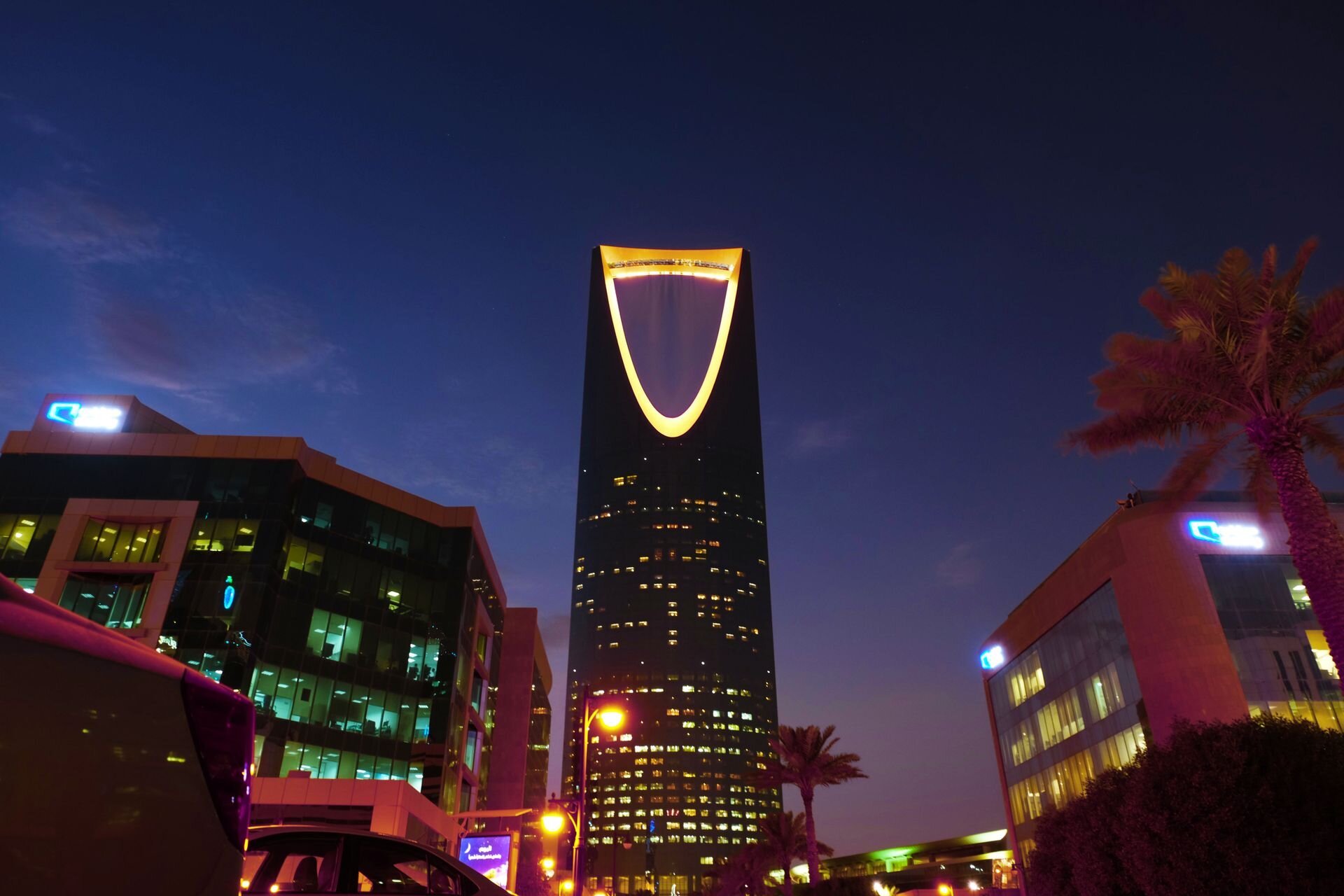 The Kingdom Centre lit gold at dusk, Riyadh