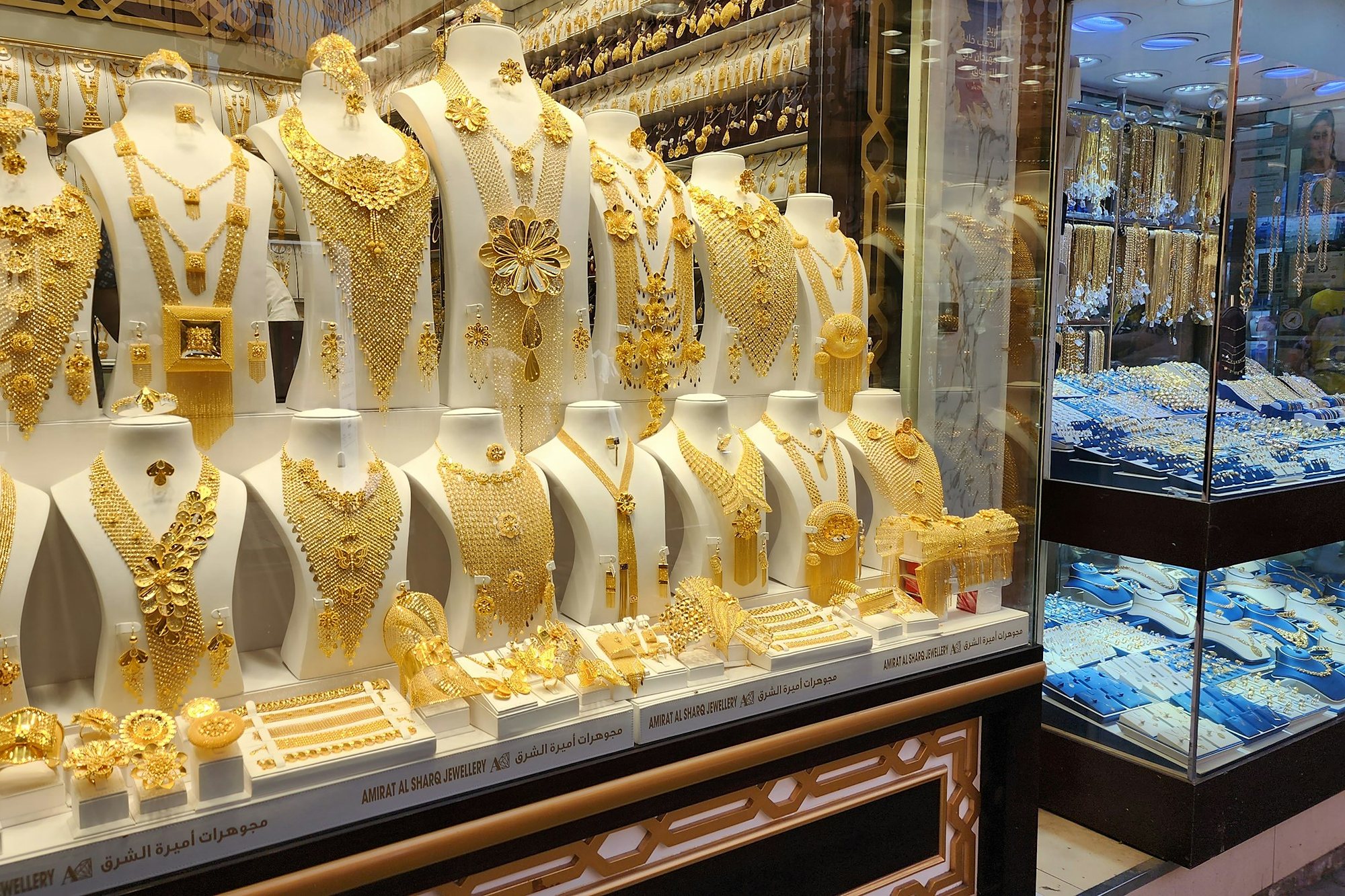 Gold necklaces in a jeweller’s window in the Dubai Gold Souk