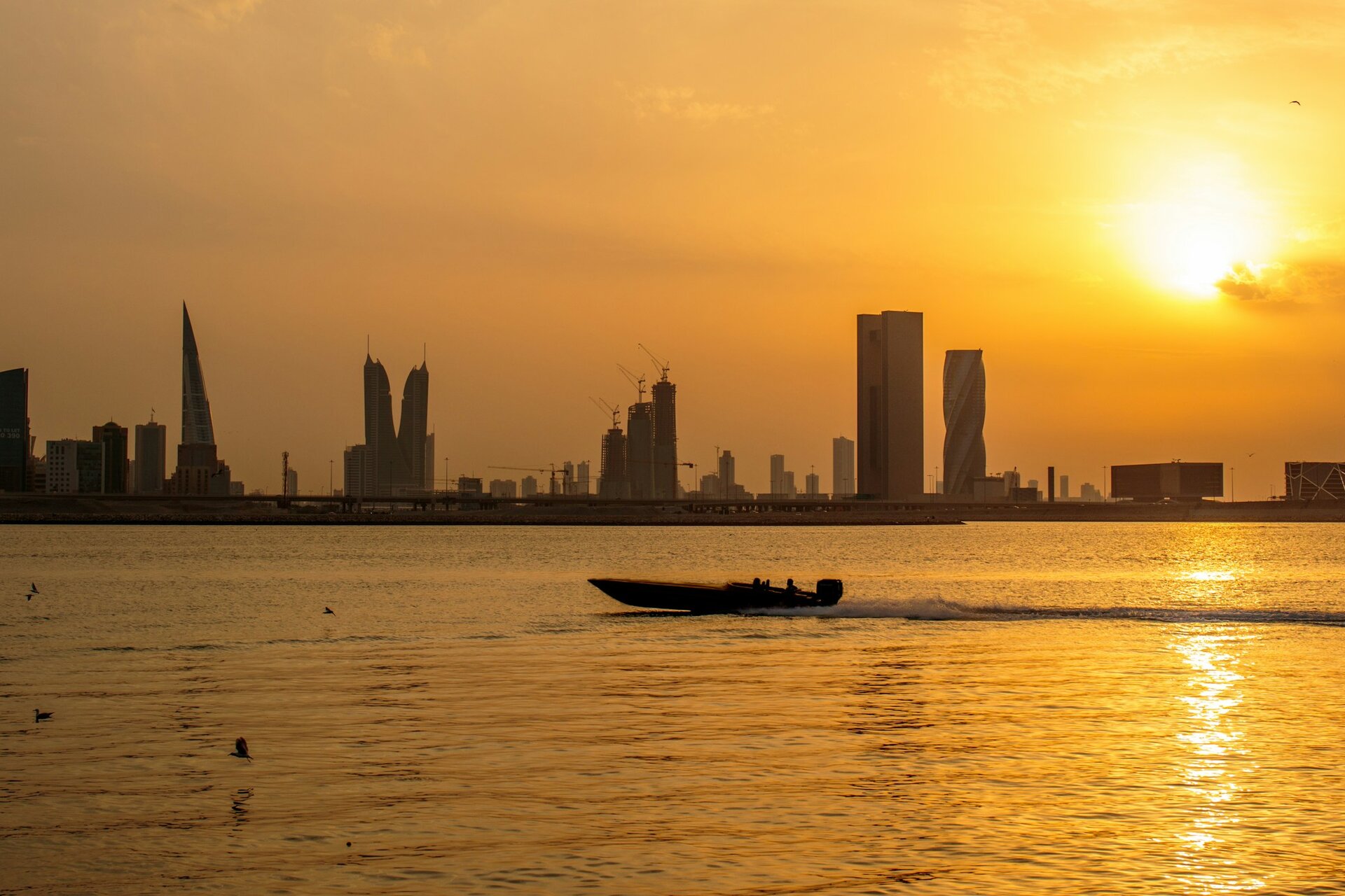 The skyline of Manama, with the Bahrain World Trade Center and the Financial Harbour, at sunset