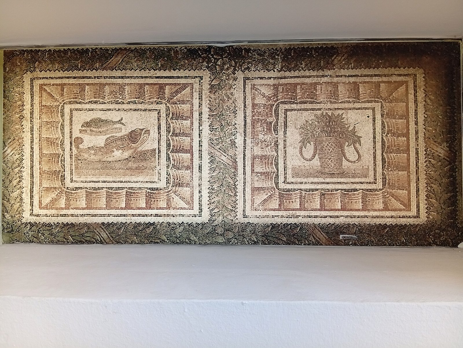 A Roman mosaic of a fish and a fruit basket displayed at the Bardo National Museum, Tunis.