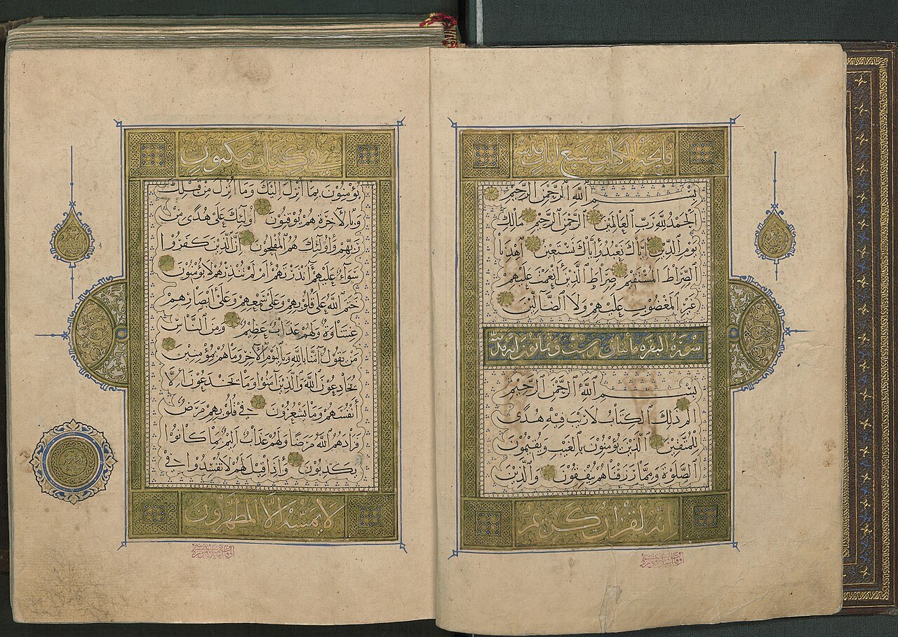 Two illuminated pages of a Quran written by the master calligrapher Yaqut al-Musta'simi, framed in gold and green.