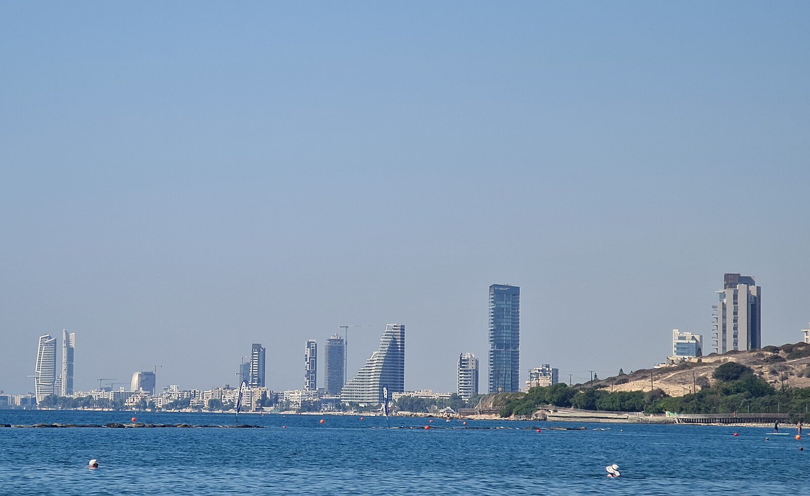 The modern high-rise skyline of Limassol rising along the blue Mediterranean shore, Cyprus.