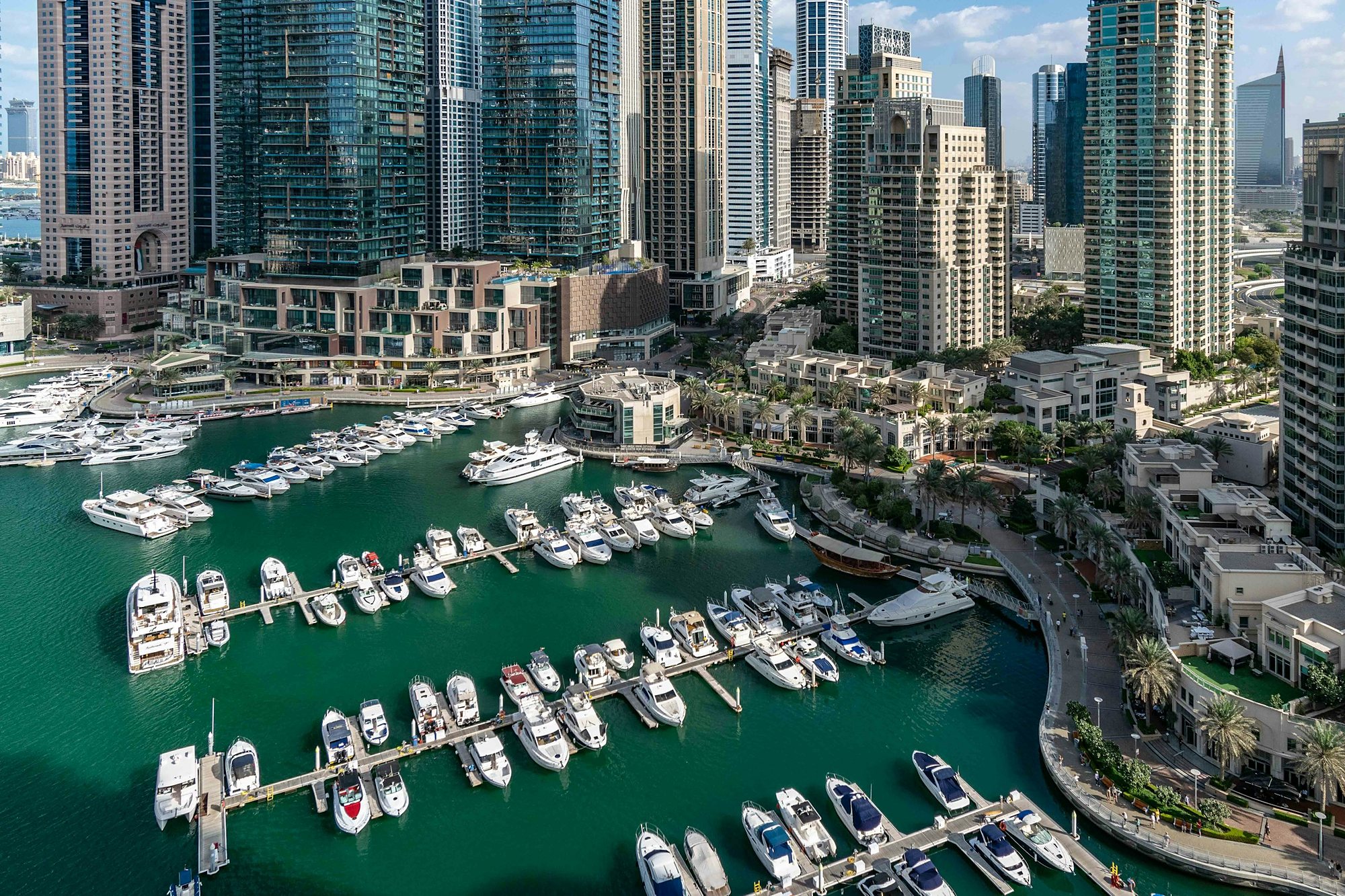 Yachts in Dubai Marina beneath the towers