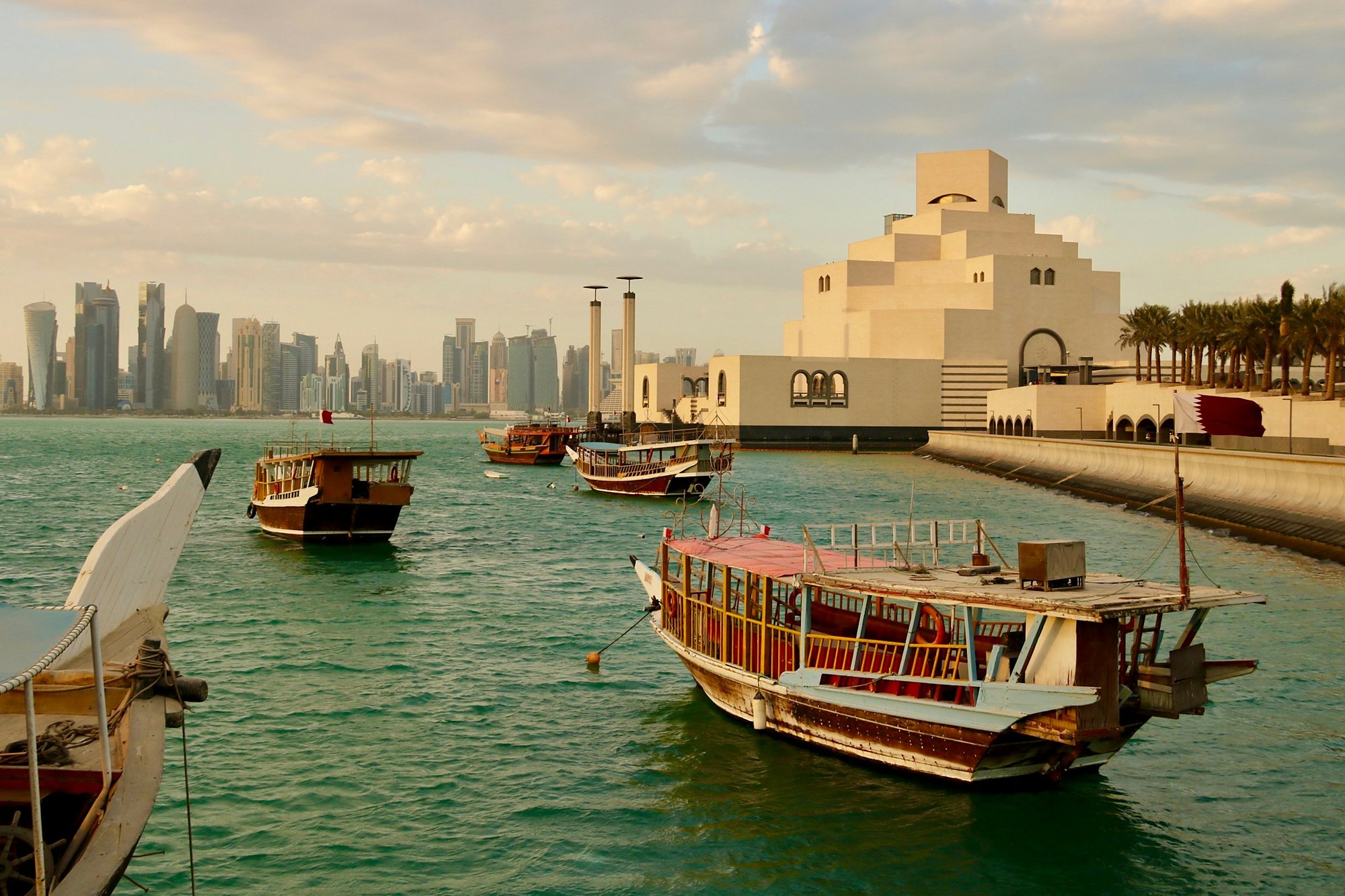 Dhows beside the Museum of Islamic Art with the Doha skyline