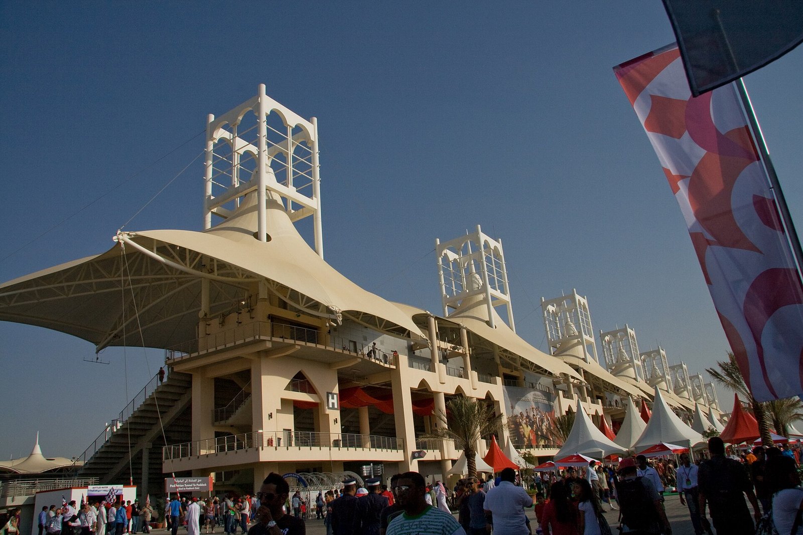 The tented grandstands and towers of the Bahrain International Circuit on a Grand Prix weekend.