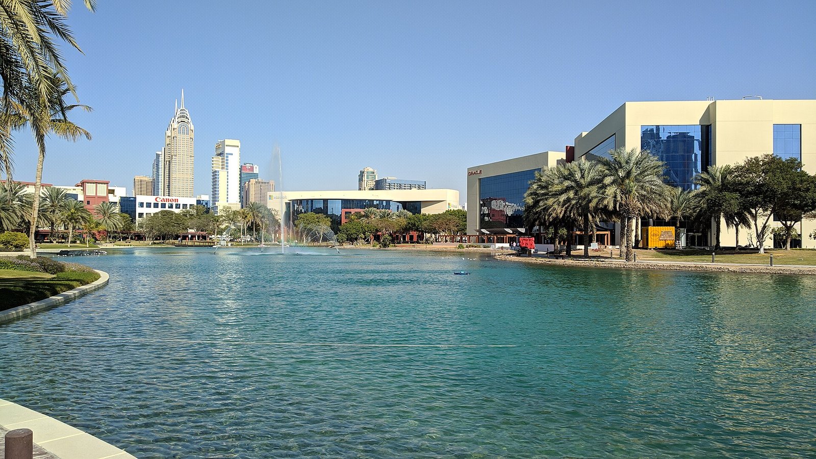 Palms and glass offices ring the lake and fountain at the heart of Dubai Internet City, the emirate's technology campus.