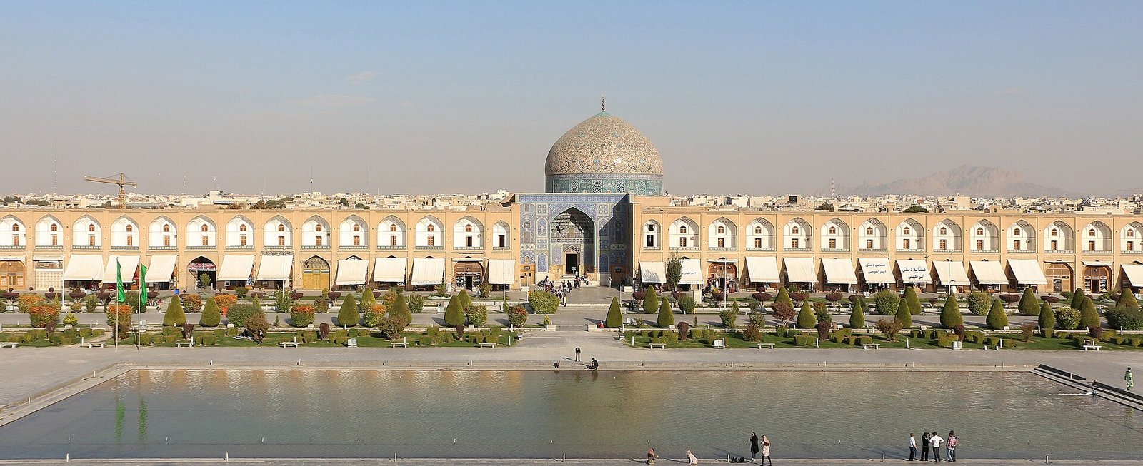 Naqsh-e Jahan Square in Isfahan, with its long pool, arcades and the tiled dome of the Sheikh Lotfollah Mosque.