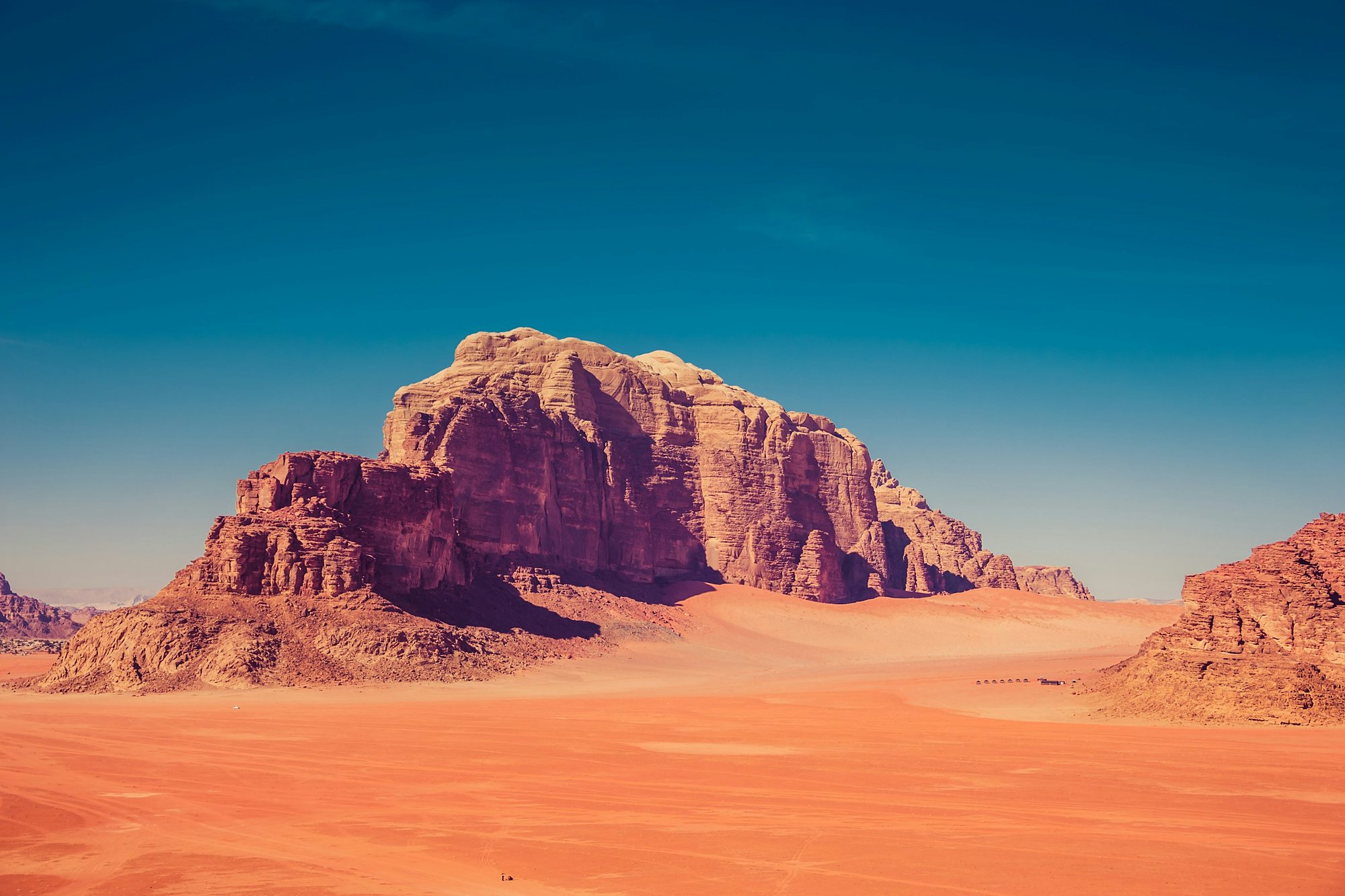 Red sand and sandstone mountains in Wadi Rum, Jordan