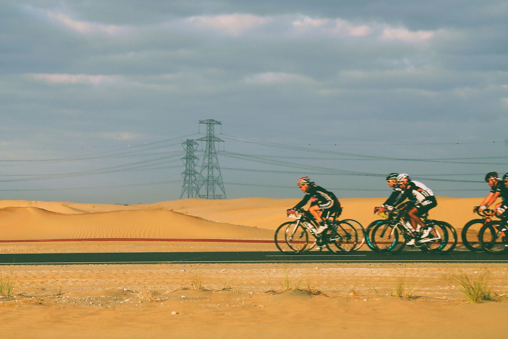 Cyclists riding the desert track at Al Qudra, Dubai