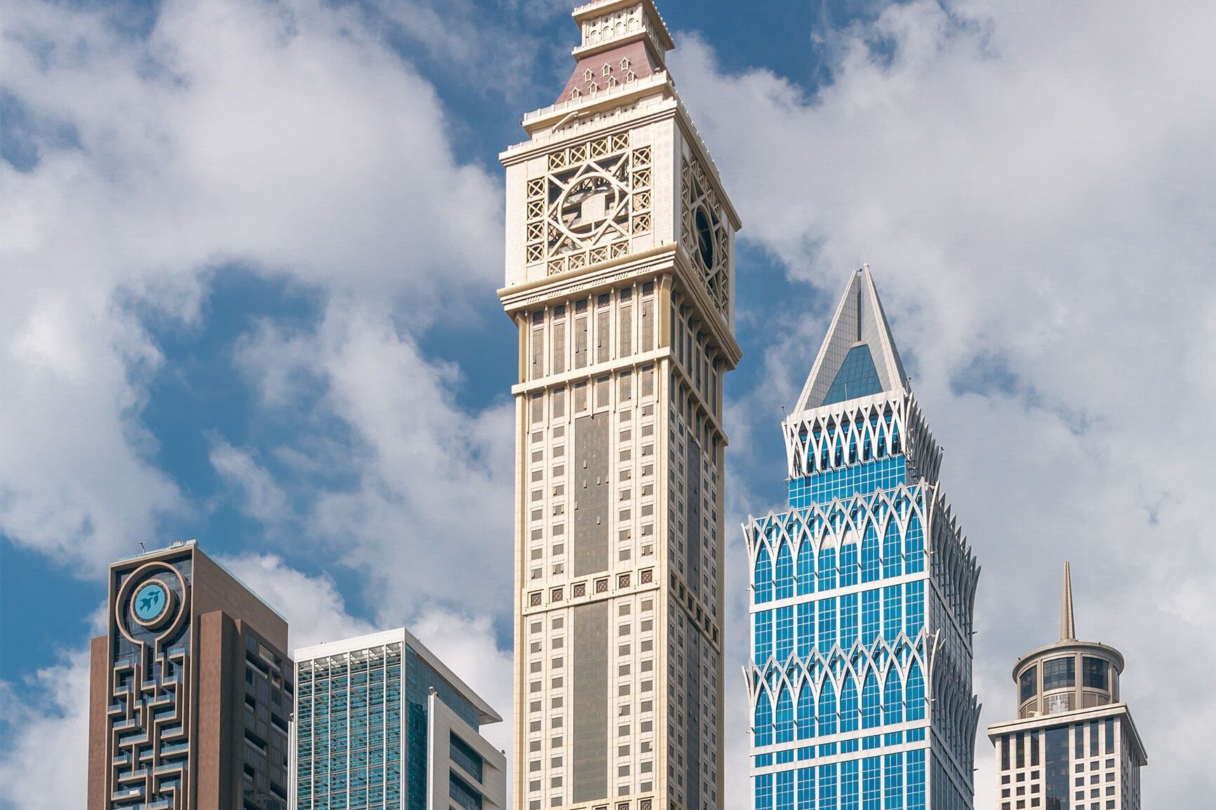 The towers of Sheikh Zayed Road, Dubai, above palms and gardens
