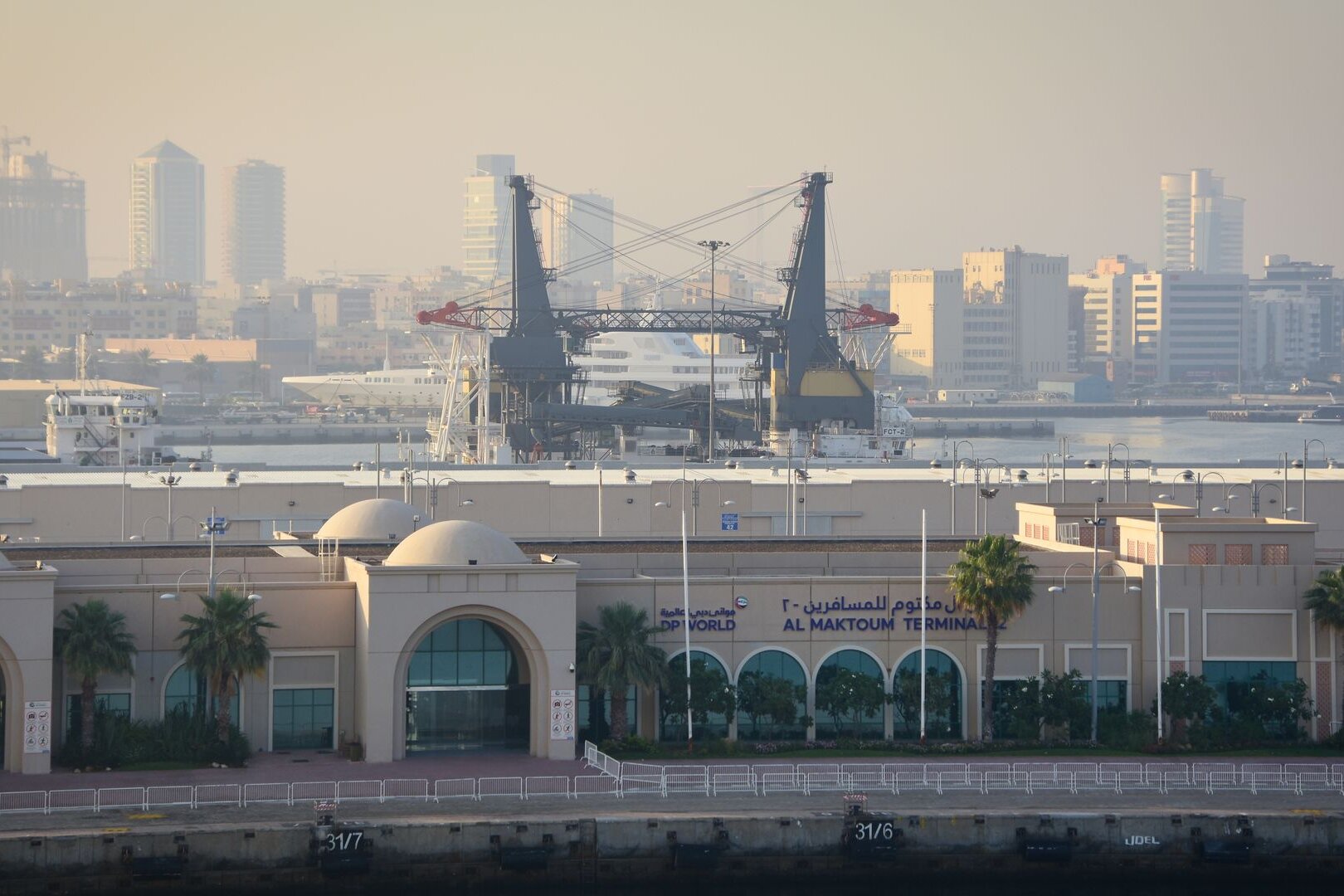 Port cranes, a superyacht and the cruise terminal at Port Rashid, Dubai, a model for the Gulf's new ports