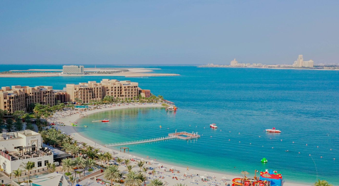 The beaches and resorts of Al Marjan Island, Ras Al Khaimah, with the island’s new towers across the water