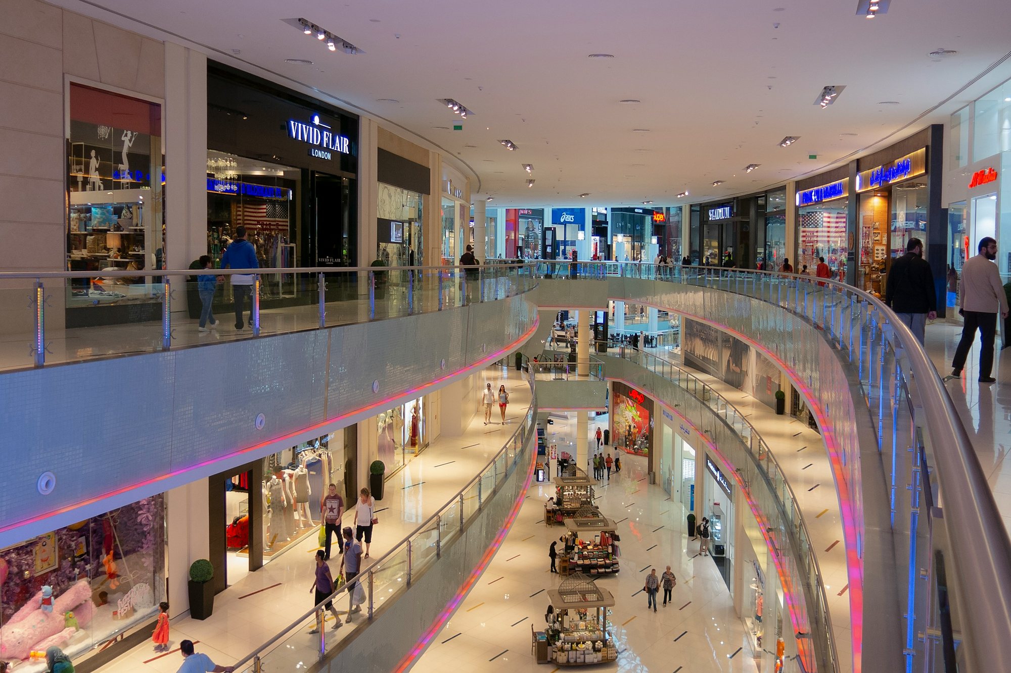 Shoppers on the curving galleries of a great Dubai mall