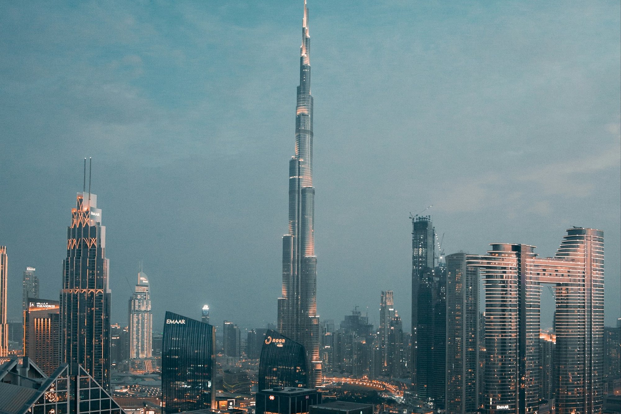 The Burj Khalifa and the towers of Downtown Dubai at dusk