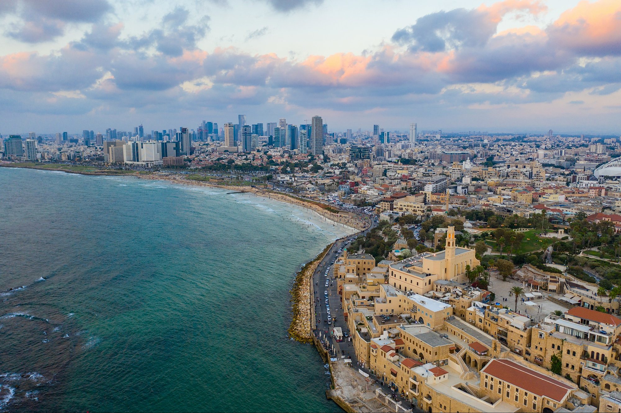 Old Jaffa and the Tel Aviv beaches and skyline from the air at sunset