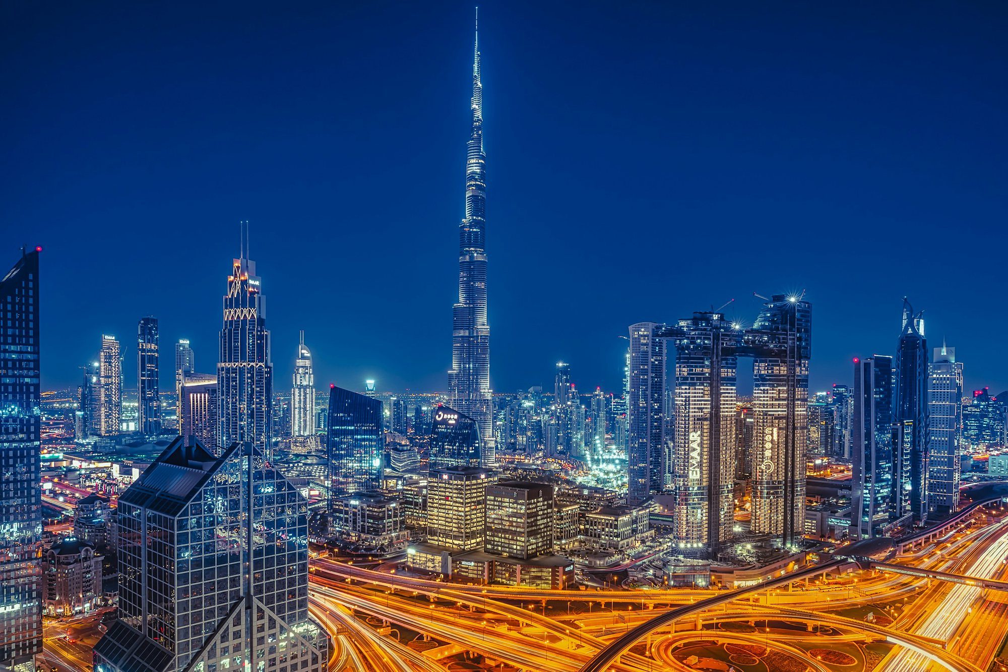 Downtown Dubai and the Burj Khalifa lit up at dusk