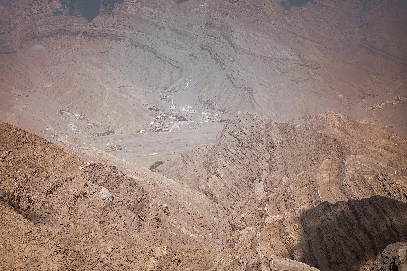 A mountain village far below the ridges of the Hajar range near Jebel Jais