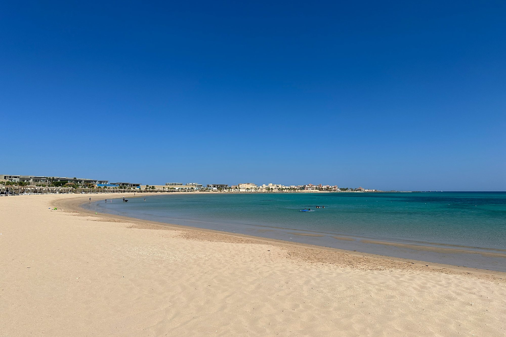 A wide sandy bay on clear Red Sea water at Soma Bay, Egypt