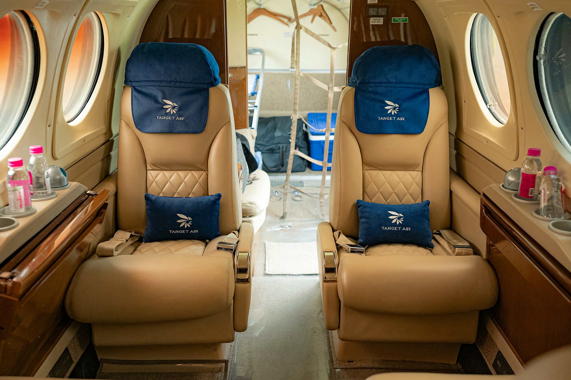 Cream leather seats in a private aircraft cabin