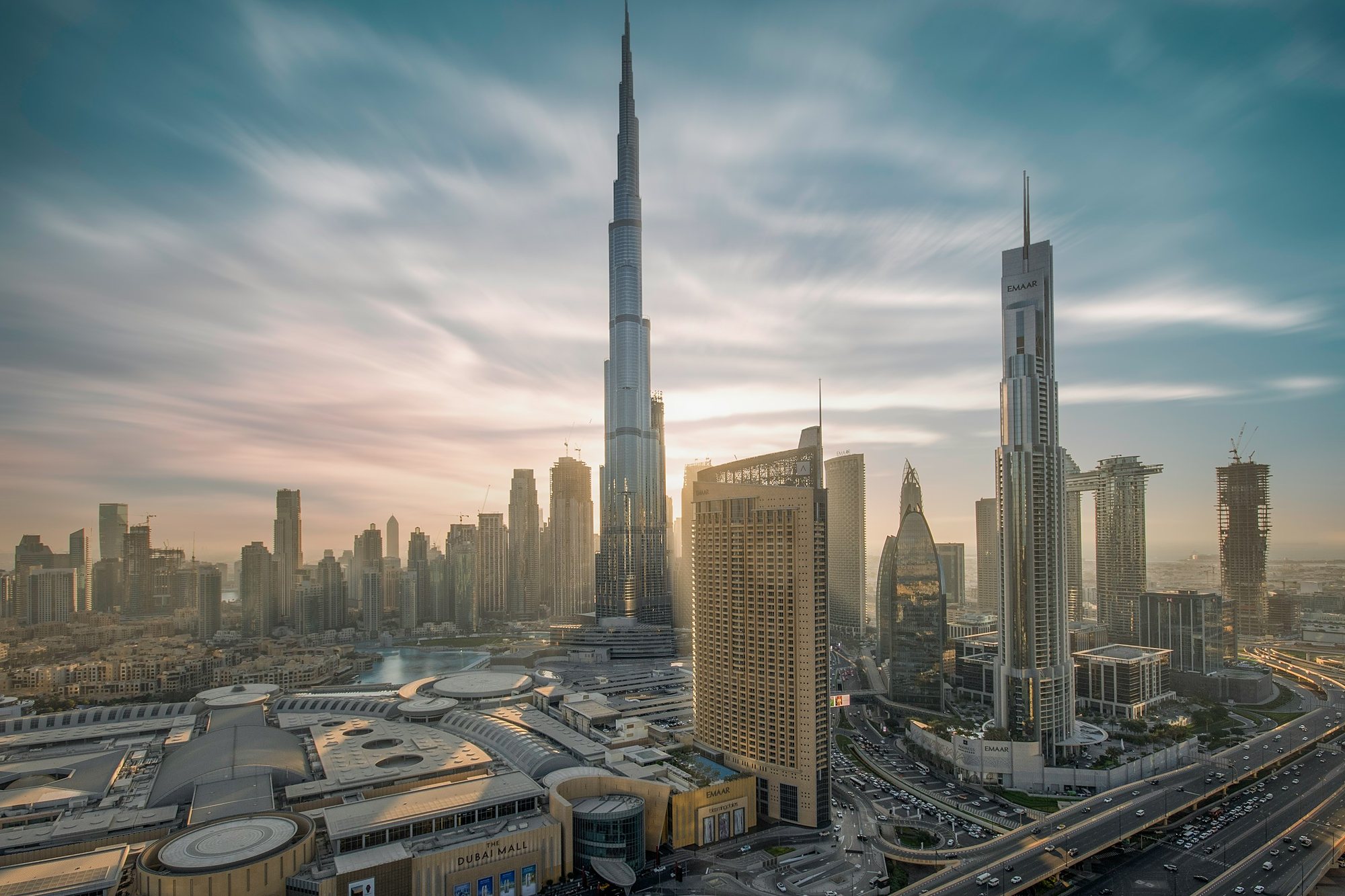 The Burj Khalifa and Downtown Dubai under a sweeping sky