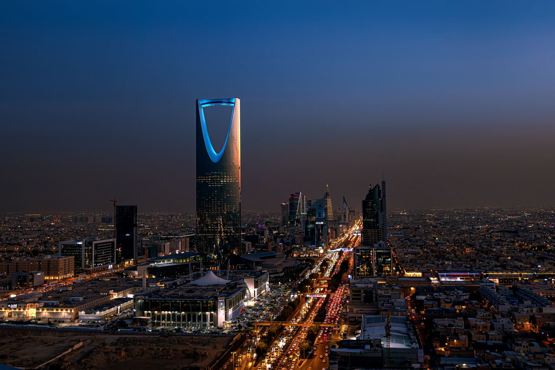 The Kingdom Centre and King Fahd Road lit at dusk, Riyadh