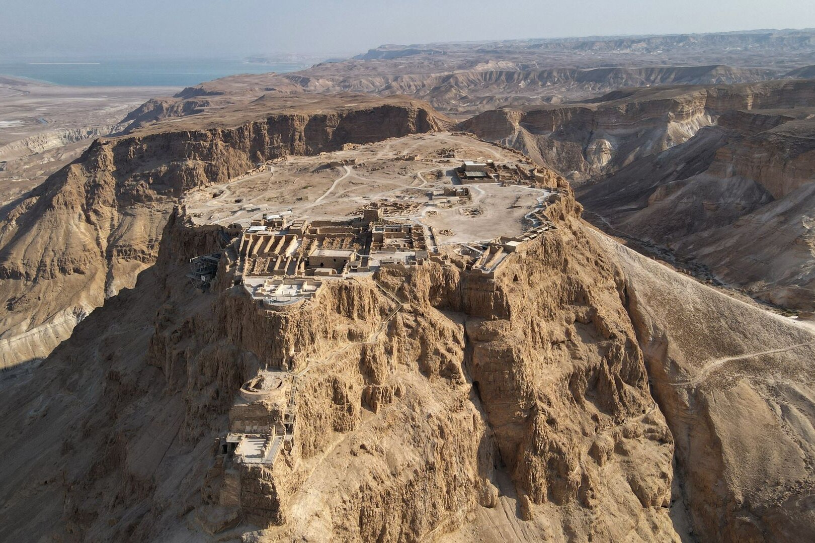 Masada from the air, with the Dead Sea on the horizon