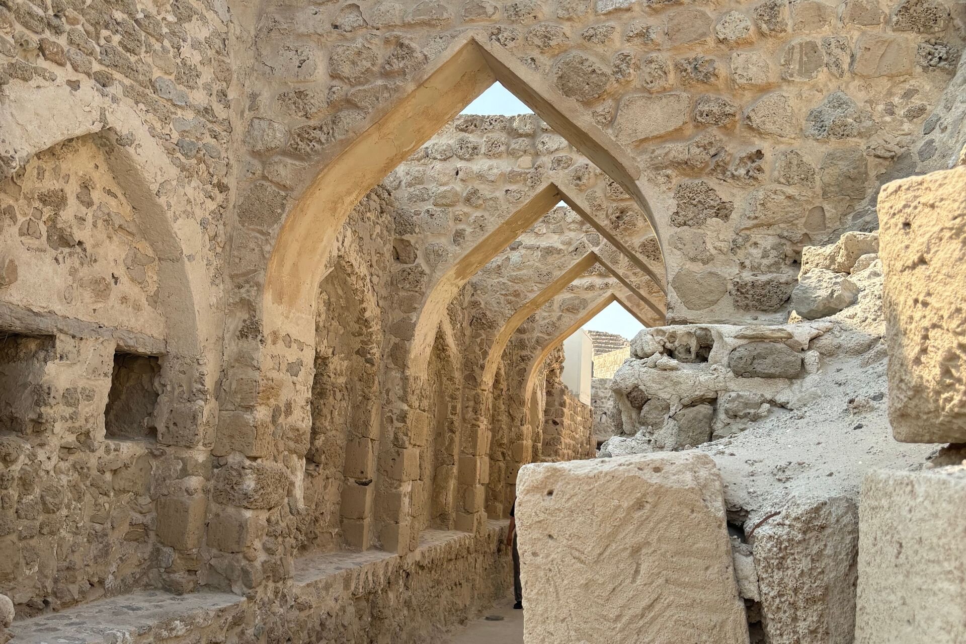 Pointed stone arches inside Qal'at al-Bahrain, the Bahrain Fort