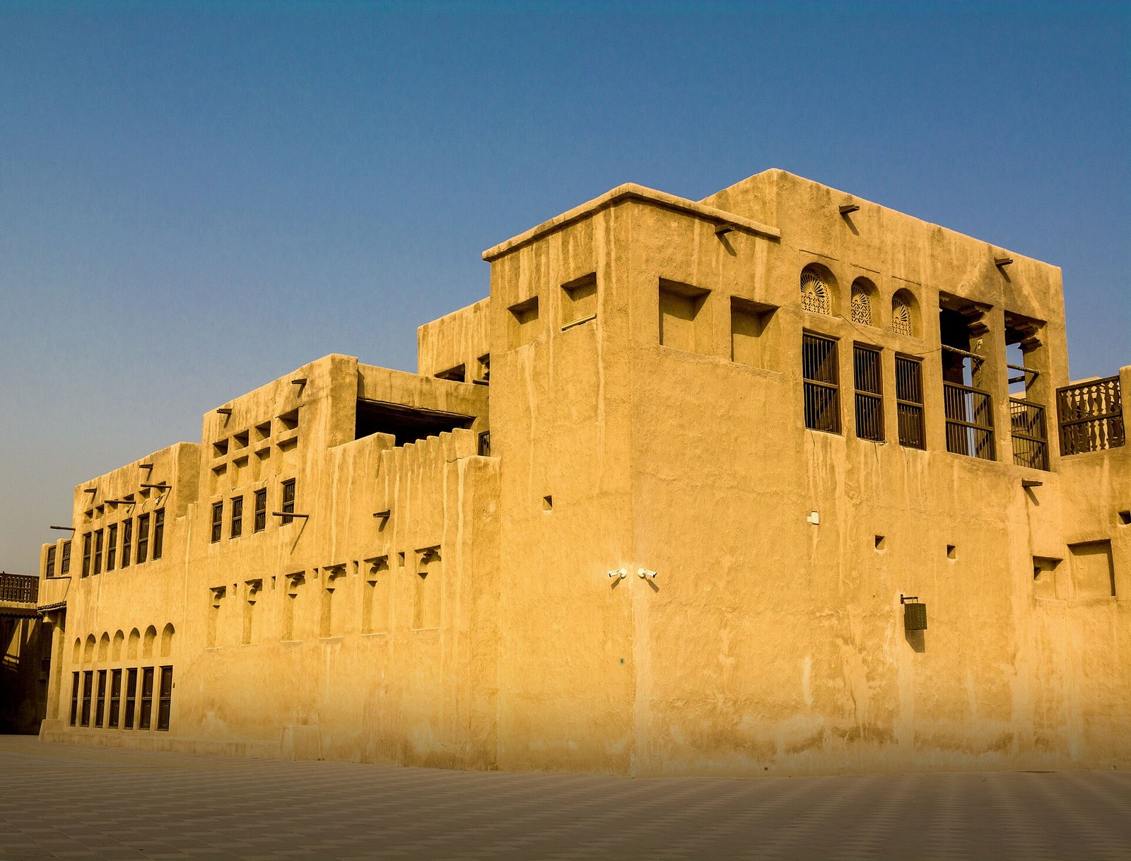 The coral-stone Sheikh Saeed Al Maktoum House in Al Shindagha, home of Dubai's ruler from 1912 to 1958, in golden light