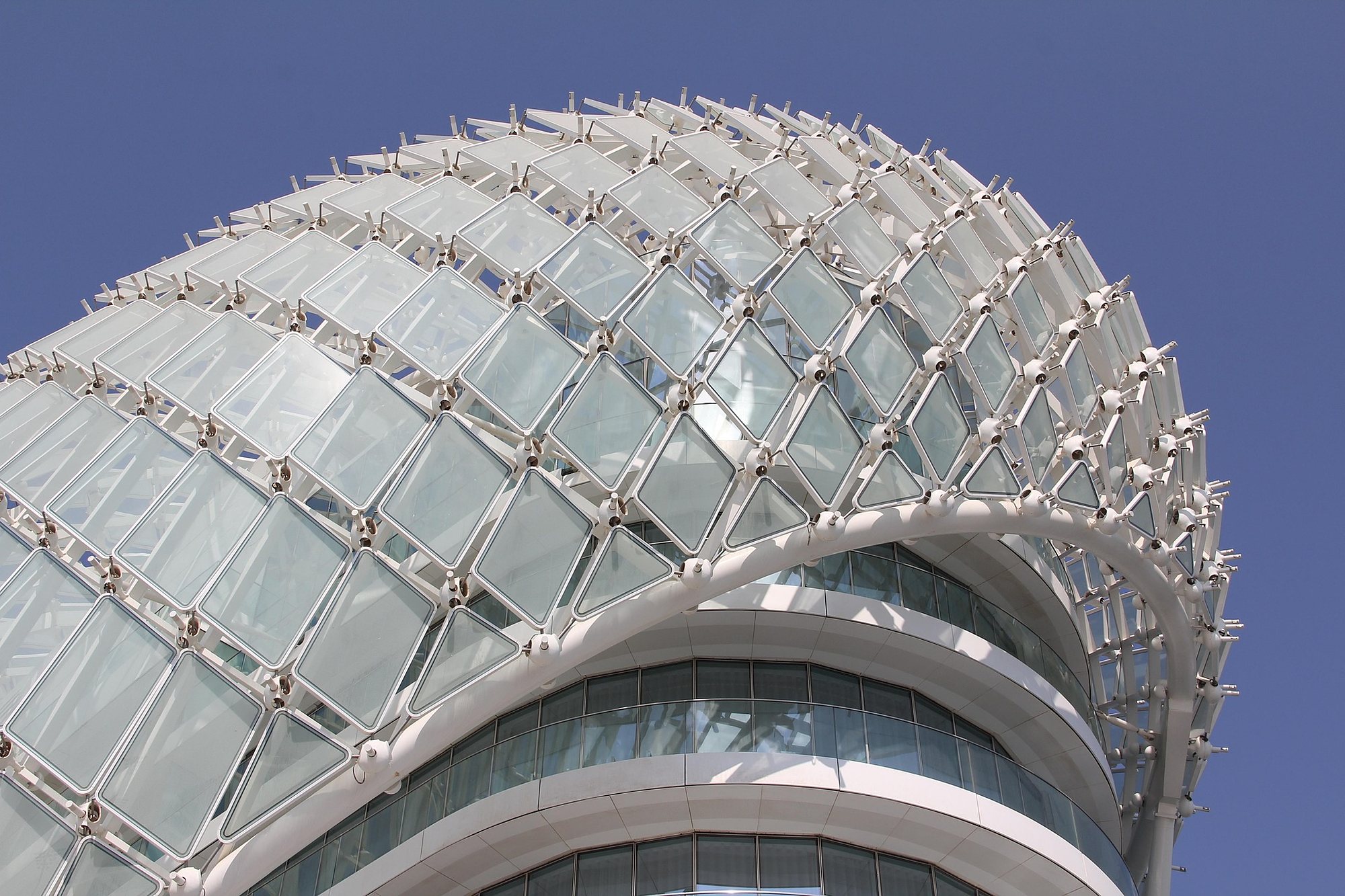 The glass gridshell of the W Abu Dhabi hotel over the Yas Marina Circuit