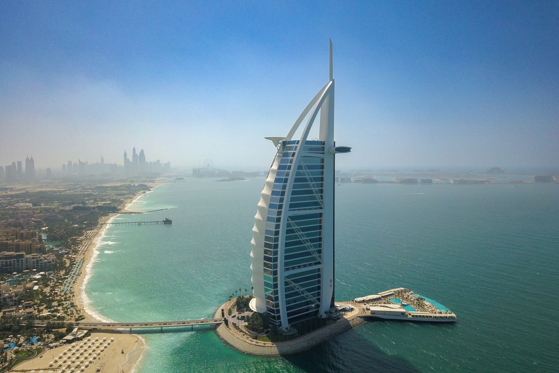 The Burj Al Arab on its island, with Jumeirah Beach and the Palm beyond, Dubai