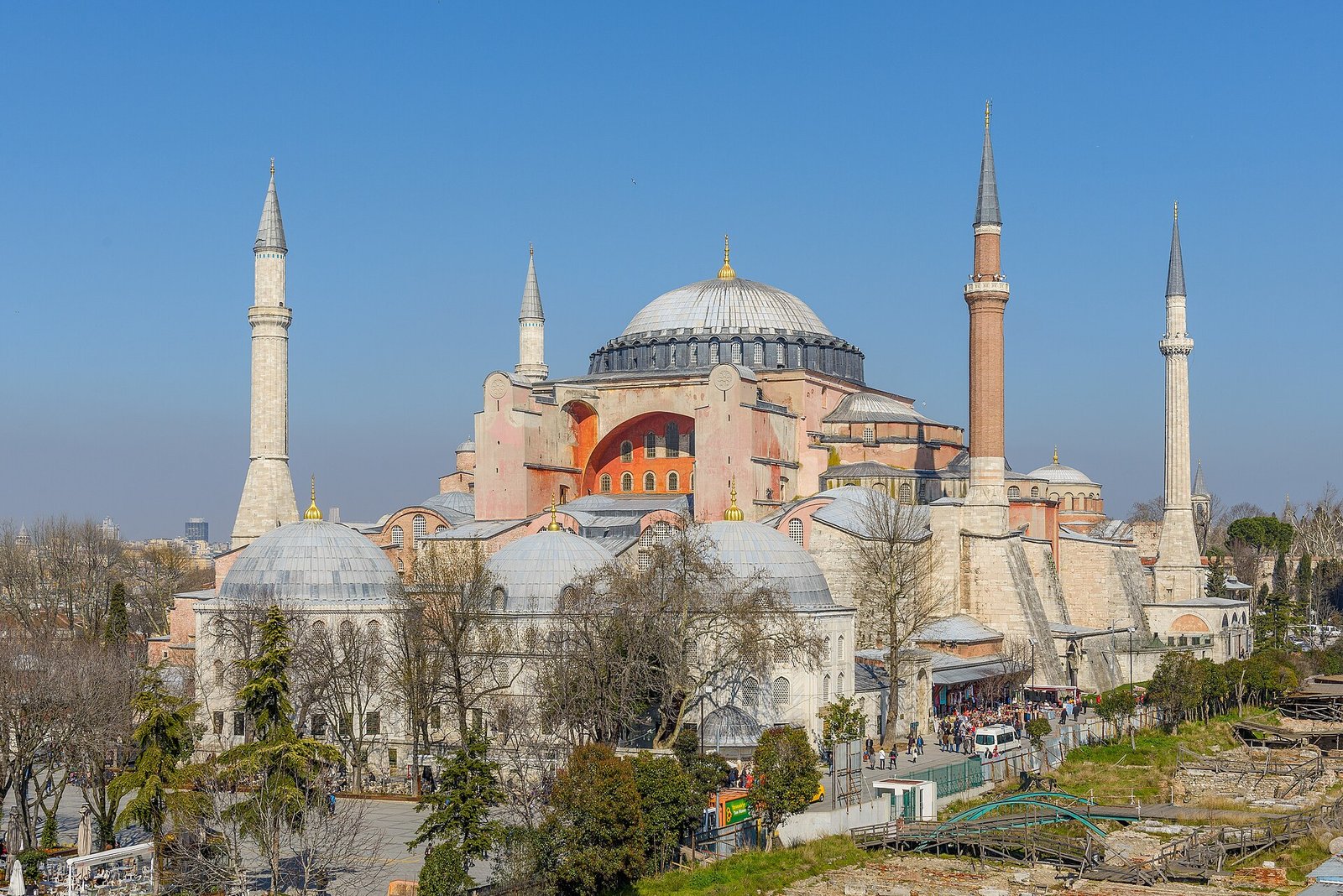 The domes and minarets of Hagia Sophia in Istanbul under a clear blue sky.
