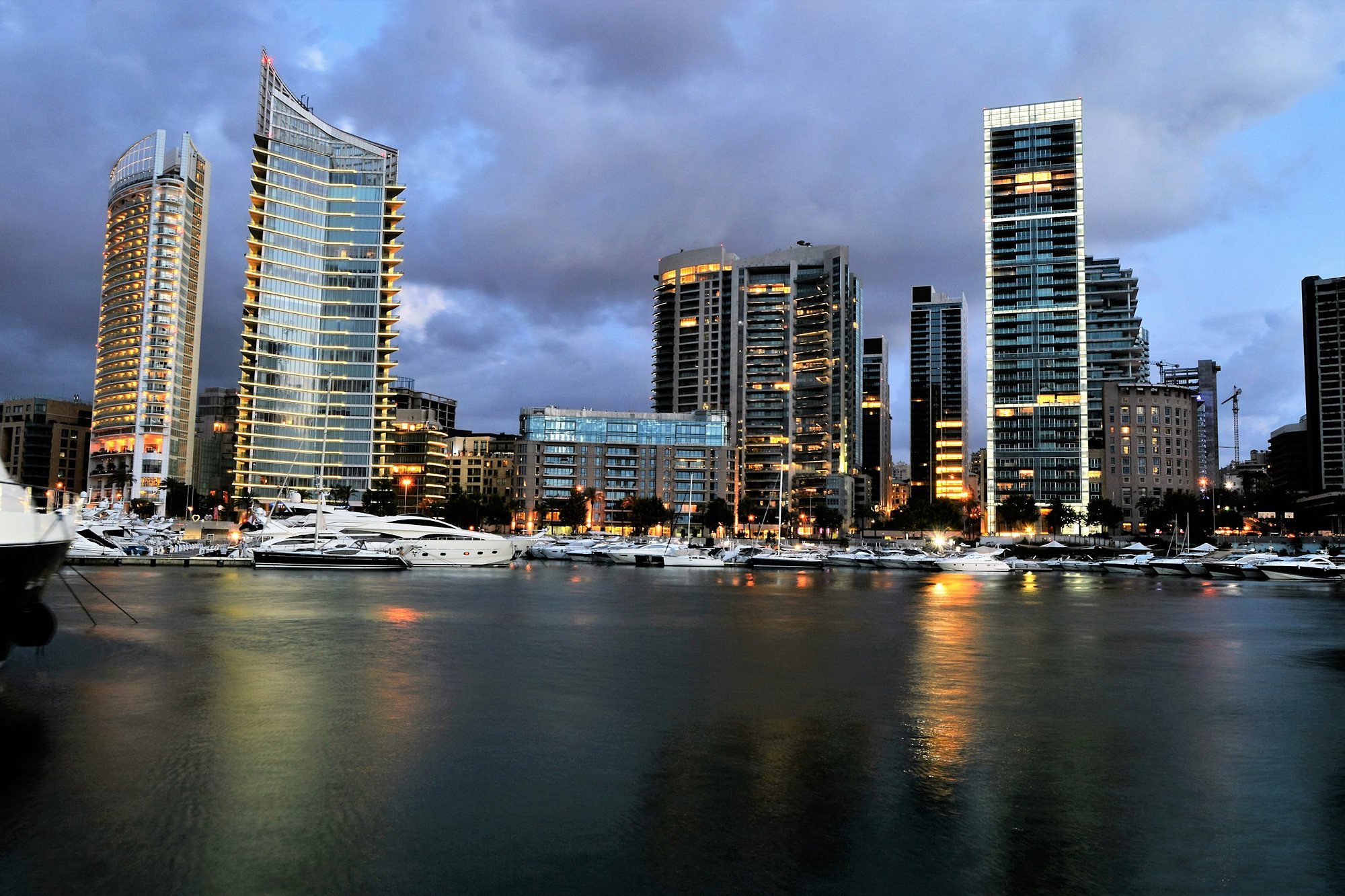 Yachts in Zaitunay Bay below the Beirut waterfront towers at dusk
