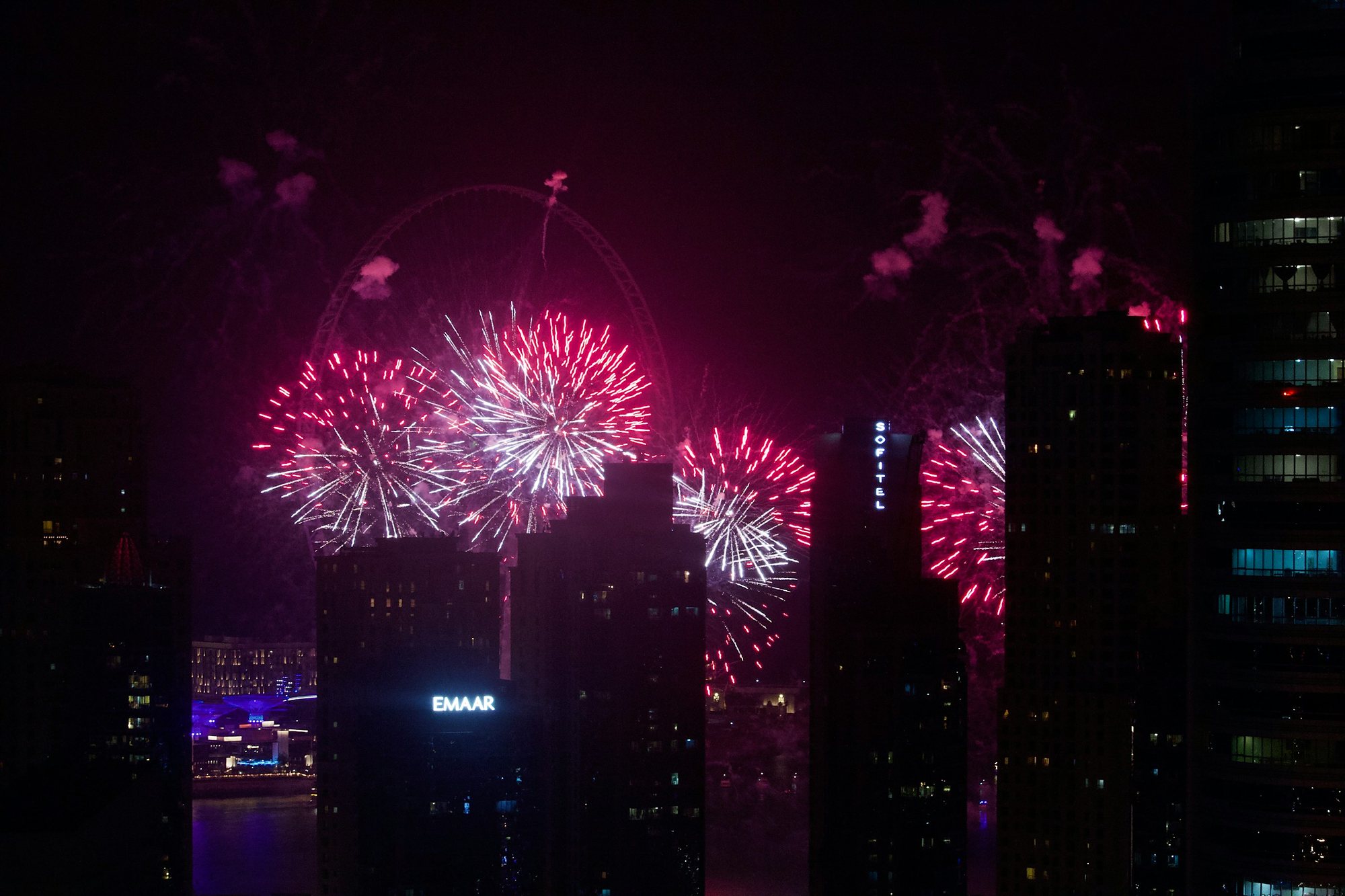 Fireworks over the towers of Dubai Marina and Bluewaters