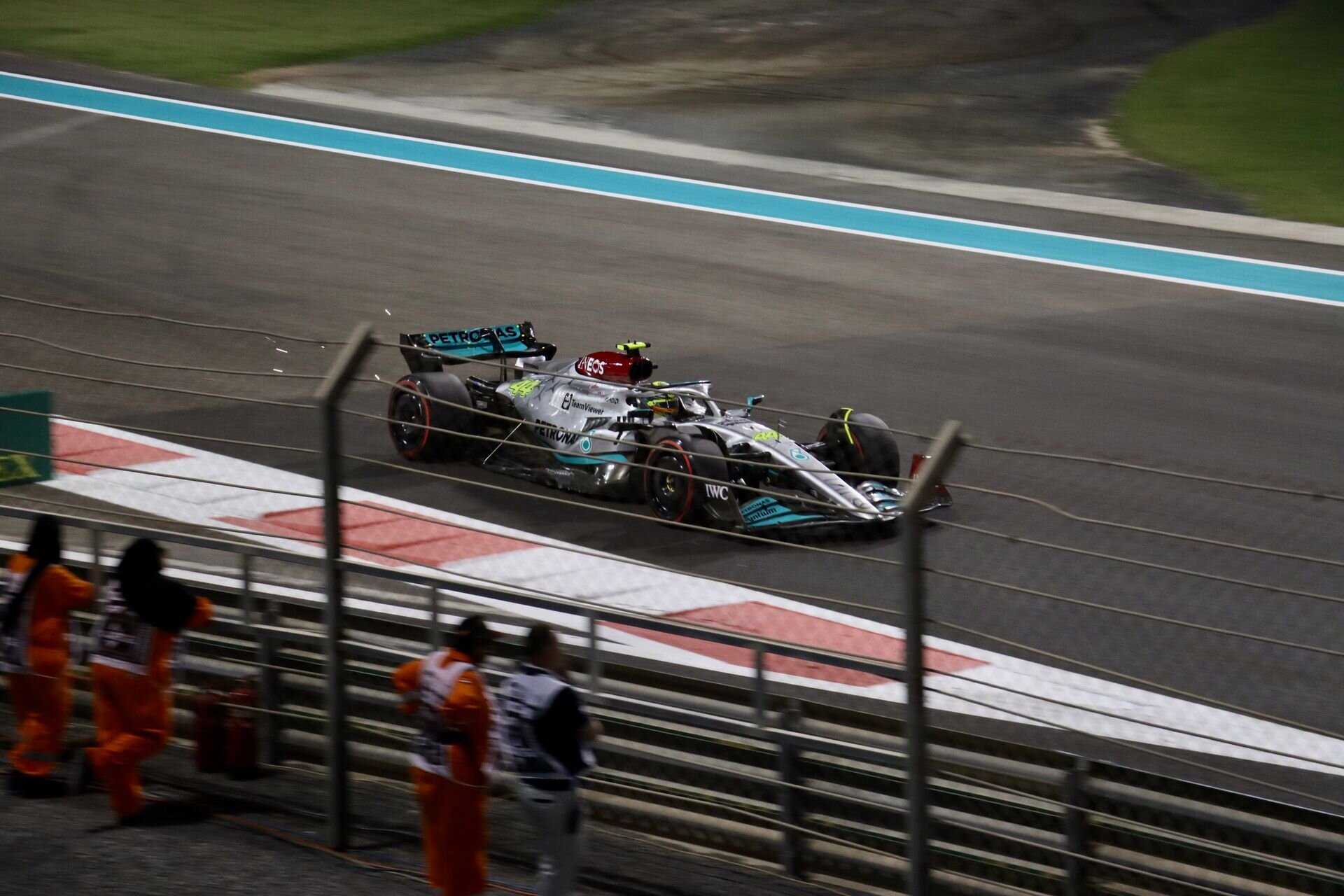 A Formula 1 car racing under the lights at the Yas Marina Circuit, Abu Dhabi
